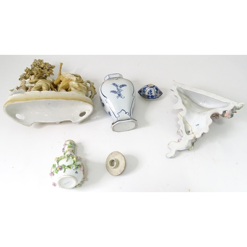 311 - A quantity of assorted ceramics to include a Continental wall bracket with flower decoration, a Delf... 