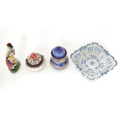 315 - A quantity of assorted ceramics to include a German photograph frame with ceramic surround decorated... 