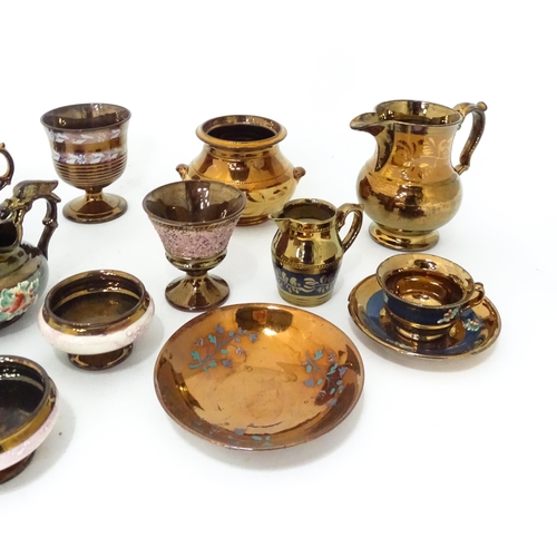 324 - A quantity of assorted lustre ware items to include jugs, tankards, mugs, goblets, vase, etc. To inc... 