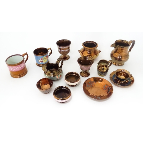 324 - A quantity of assorted lustre ware items to include jugs, tankards, mugs, goblets, vase, etc. To inc... 