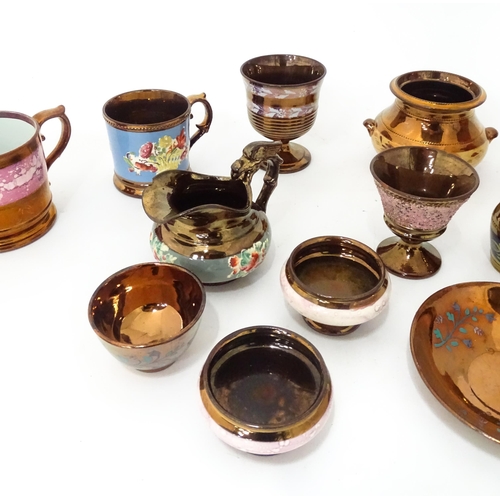 324 - A quantity of assorted lustre ware items to include jugs, tankards, mugs, goblets, vase, etc. To inc... 