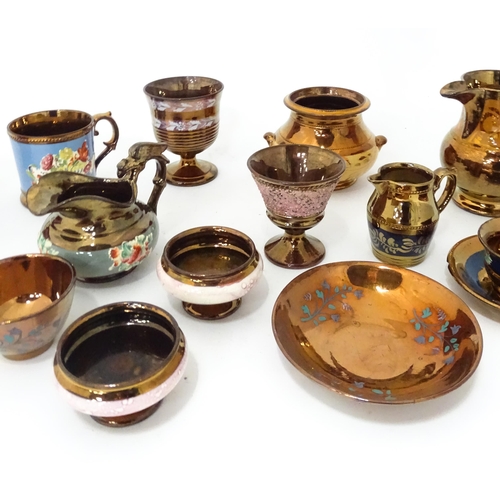 324 - A quantity of assorted lustre ware items to include jugs, tankards, mugs, goblets, vase, etc. To inc... 