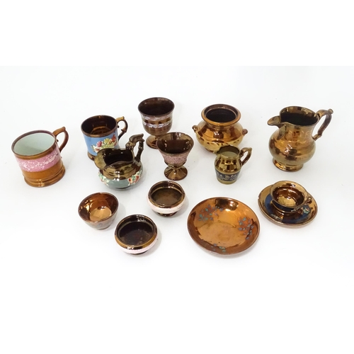 324 - A quantity of assorted lustre ware items to include jugs, tankards, mugs, goblets, vase, etc. To inc... 