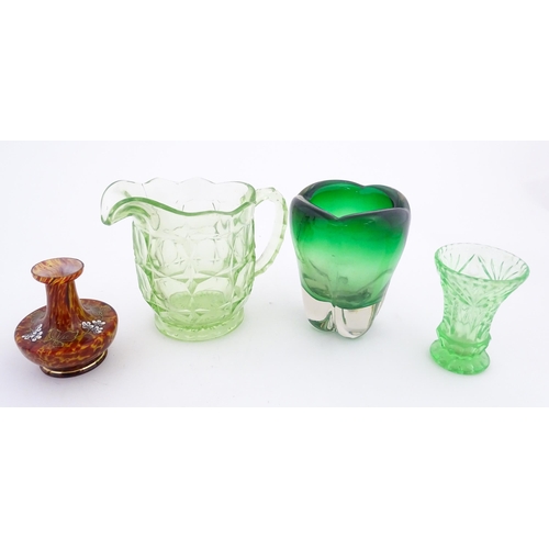 532 - Four items of glassware to include a green sommerso art glass vase, a Uranian green jug, etc. Green ... 