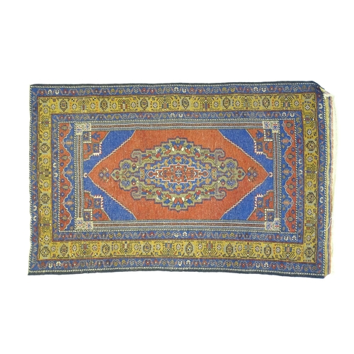 626 - Carpet / Rug :  A blue and red ground rug the central motif with floral and geometric detail and ban... 