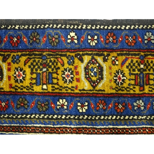 626 - Carpet / Rug :  A blue and red ground rug the central motif with floral and geometric detail and ban... 