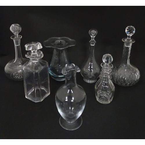 629 - A quantity of assorted 19thC and later glass ware to include decanters, carafes, vase, etc. Largest ... 