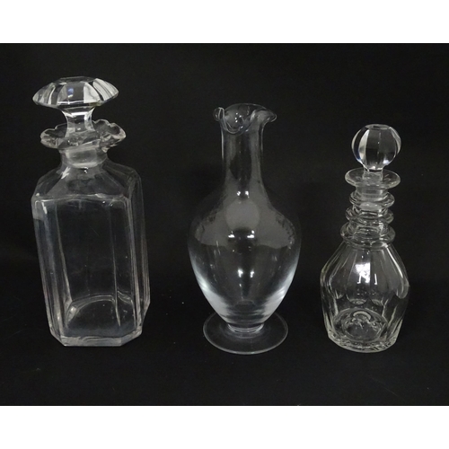 629 - A quantity of assorted 19thC and later glass ware to include decanters, carafes, vase, etc. Largest ... 