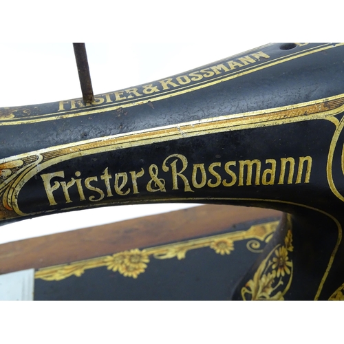 651 - An early 20thC Frister & Rossmann hand crank sewing machine with floral and foliate decoration. The ... 