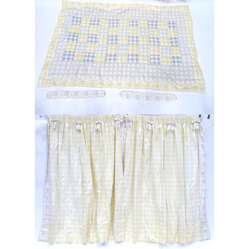 652 - A pair of curtains decorated in a yellow and white check pattern with bow detail. Together with a ma... 