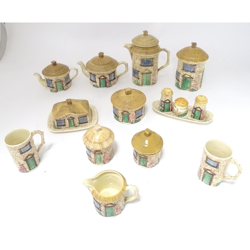 653 - A quantity of Sylvac cottage wares to include teapot, hot water pot, butter dish, sugar pot, cruet s... 