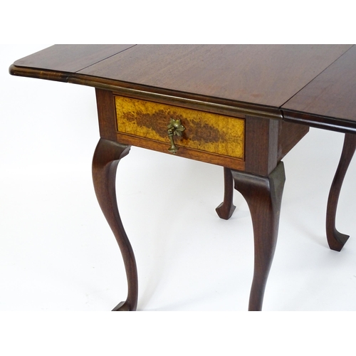 660 - A mid / late 20thC mahogany drop flap table raised on four cabriole legs. 18 1/2