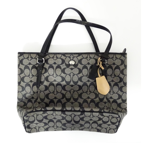 15 - Vintage Fashion: A quantity of Coach bags to include a Signature Jacquard Large Tote Bag in black, a... 