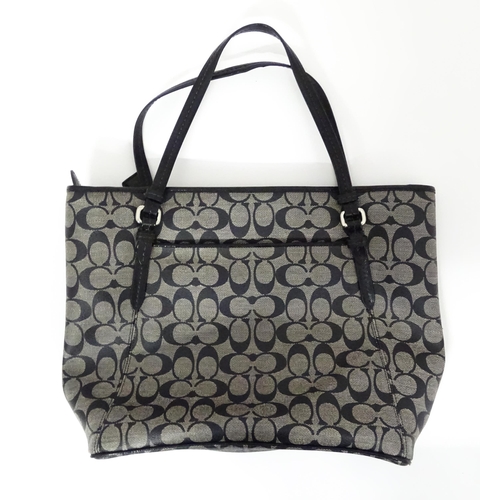 15 - Vintage Fashion: A quantity of Coach bags to include a Signature Jacquard Large Tote Bag in black, a... 