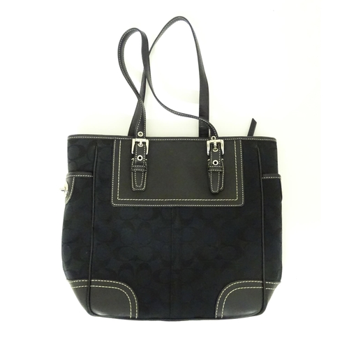 15 - Vintage Fashion: A quantity of Coach bags to include a Signature Jacquard Large Tote Bag in black, a... 