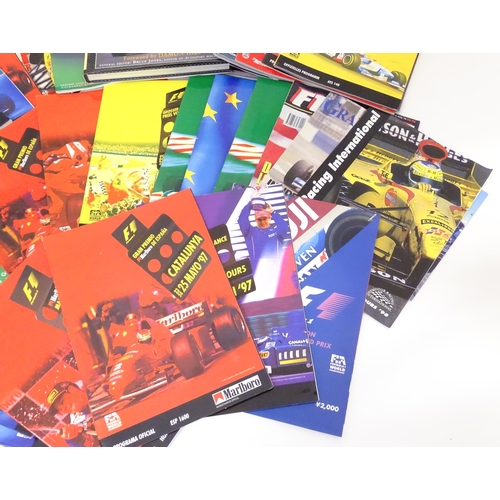 197 - A quantity of F1 motor racing memorabilia to include a Silverstone brochure signed by Stephen Hendry... 