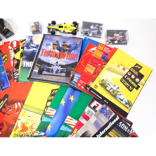 197 - A quantity of F1 motor racing memorabilia to include a Silverstone brochure signed by Stephen Hendry... 