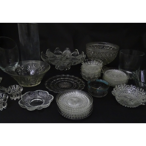 258 - A quantity of assorted 20thC and later glassware to include candlesticks, saucers, bon bon dishes, v... 