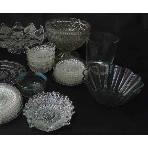 258 - A quantity of assorted 20thC and later glassware to include candlesticks, saucers, bon bon dishes, v... 