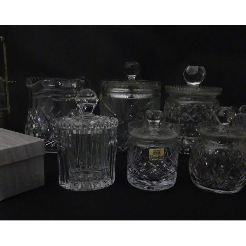 322 - A quantity of assorted cut glass cruets, preserve jars etc. The largest approx 8