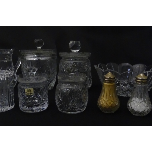 322 - A quantity of assorted cut glass cruets, preserve jars etc. The largest approx 8