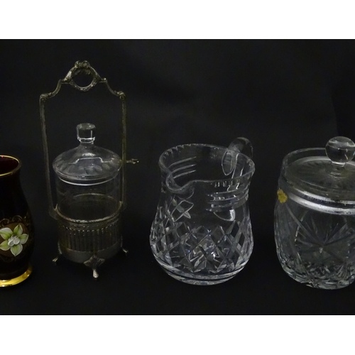 322 - A quantity of assorted cut glass cruets, preserve jars etc. The largest approx 8