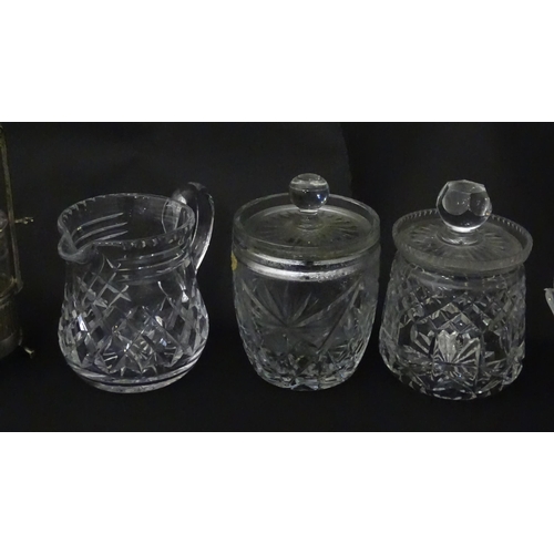 322 - A quantity of assorted cut glass cruets, preserve jars etc. The largest approx 8