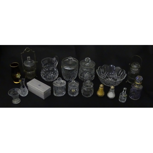 322 - A quantity of assorted cut glass cruets, preserve jars etc. The largest approx 8