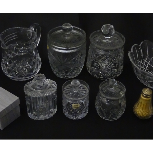 322 - A quantity of assorted cut glass cruets, preserve jars etc. The largest approx 8