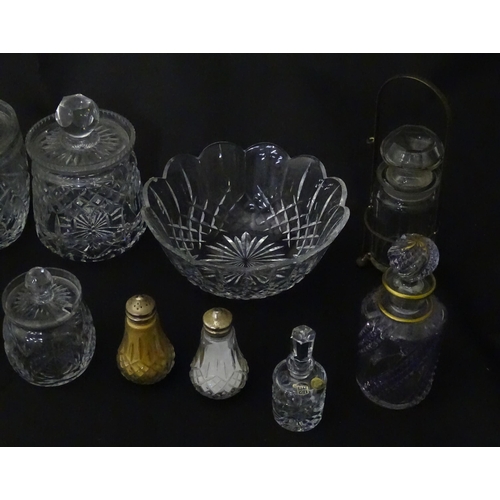 322 - A quantity of assorted cut glass cruets, preserve jars etc. The largest approx 8