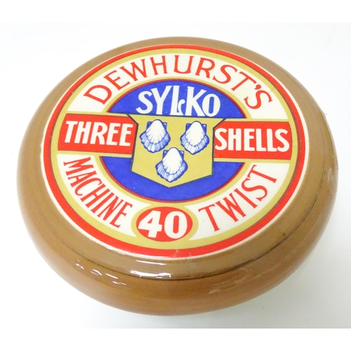 344 - A ceramic Dewhurst's advertising pot and cover formed as an oversized cotton reel and titled Dewhurs... 