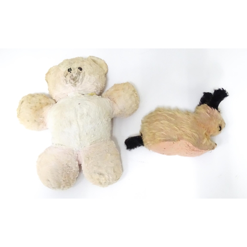 524 - Two early to mid 20thC soft toys formed as a bear and a dog, the largest approx 15