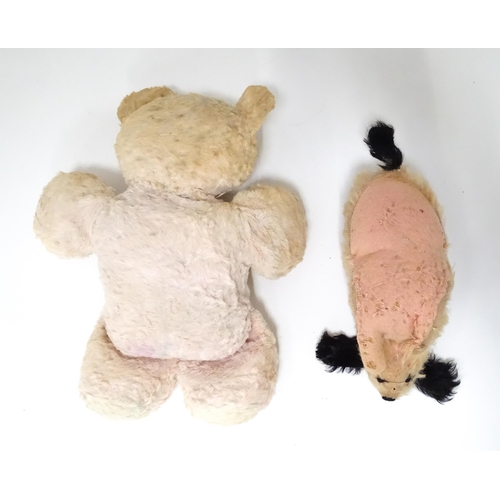 524 - Two early to mid 20thC soft toys formed as a bear and a dog, the largest approx 15