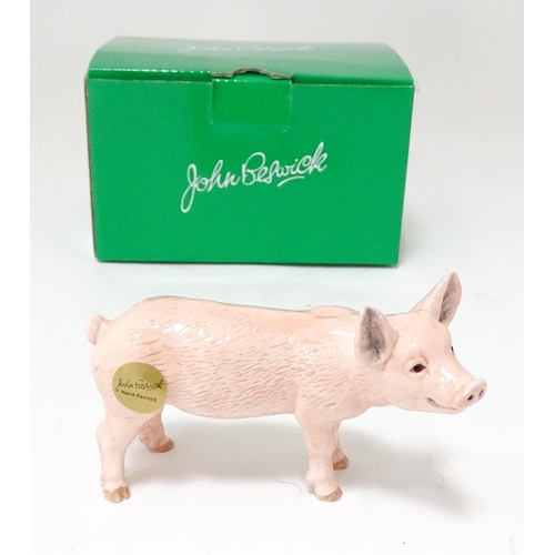 536 - A boxed John Beswick model of a white piglet. Pig approx. 4 1/2