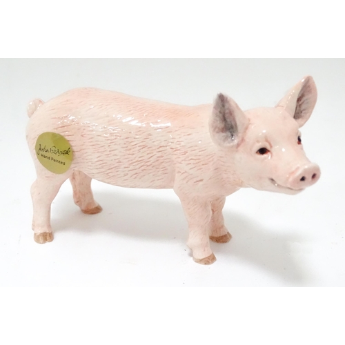 536 - A boxed John Beswick model of a white piglet. Pig approx. 4 1/2