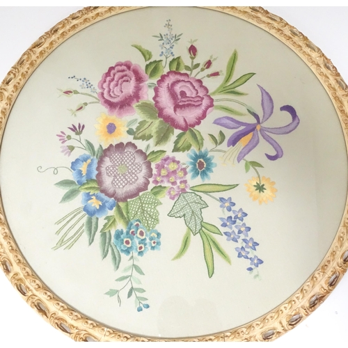 639 - A 20thC needlework embroidery depicting flowers and foliage. Approx. 18 1/2