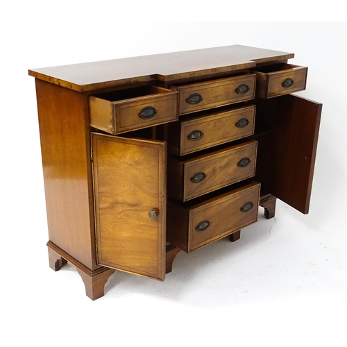 235 - A late 20thC walnut break-front sideboard of small proportions, comprising a flight of four graduate... 