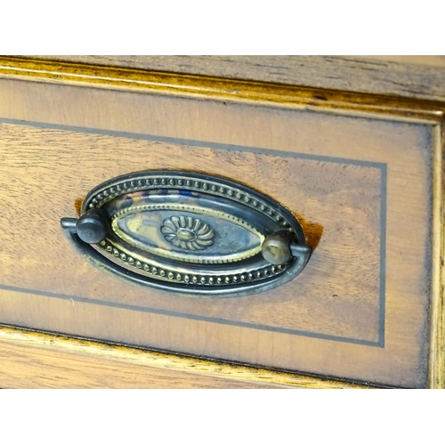 235 - A late 20thC walnut break-front sideboard of small proportions, comprising a flight of four graduate... 