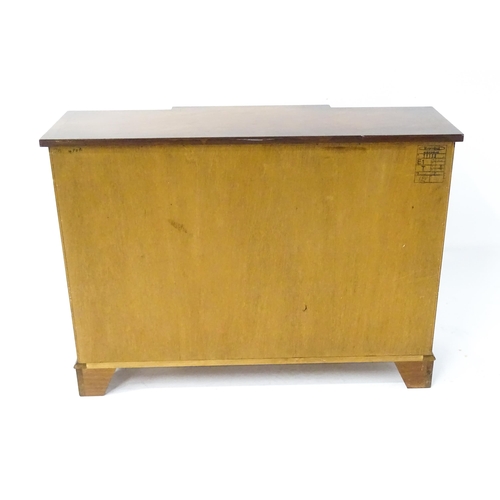 235 - A late 20thC walnut break-front sideboard of small proportions, comprising a flight of four graduate... 