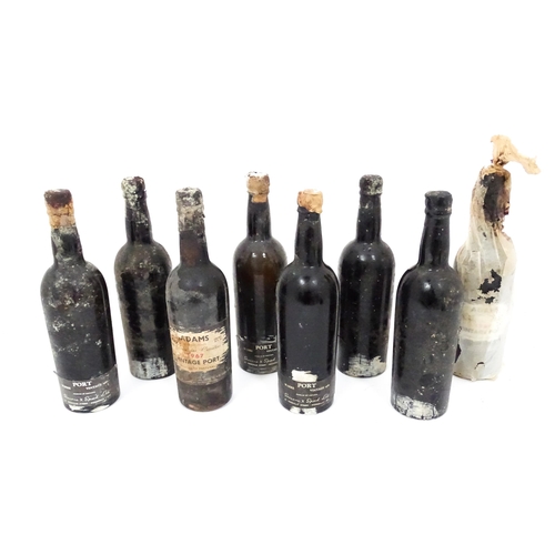 31 - A quantity of assorted bottles and part bottles of vintage port, to include Warre 1960 and Adams 196... 