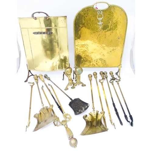 663 - A quantity of 20thC brass fire tools, to include pokers, shovels, stands and tongs etc, together wit... 