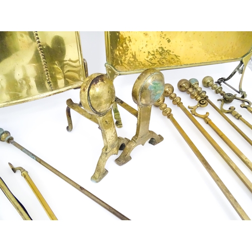 663 - A quantity of 20thC brass fire tools, to include pokers, shovels, stands and tongs etc, together wit... 