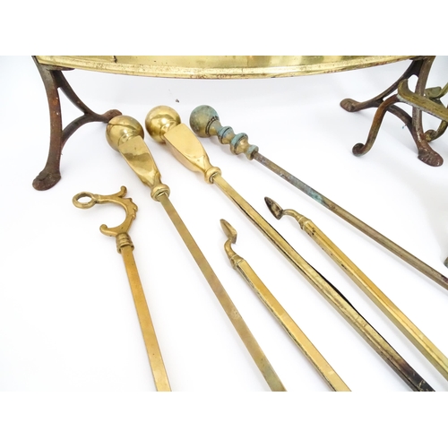 663 - A quantity of 20thC brass fire tools, to include pokers, shovels, stands and tongs etc, together wit... 