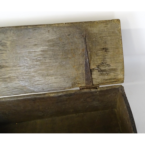 1 - An 18thC oak coffer / sword chest with a hinged lid above a panelled front raised on stile feet. 41