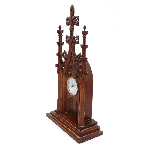 14 - A 20thC oak cased mantle clock of Gothic architectural form, the central dial signed Precista. Appro... 