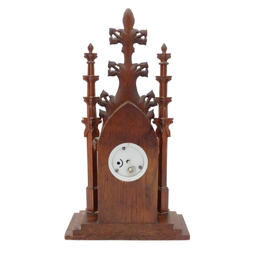 14 - A 20thC oak cased mantle clock of Gothic architectural form, the central dial signed Precista. Appro... 