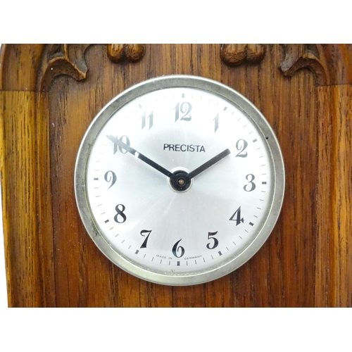 14 - A 20thC oak cased mantle clock of Gothic architectural form, the central dial signed Precista. Appro... 