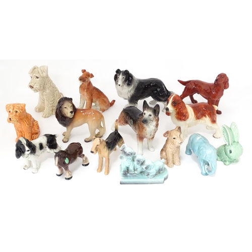 347 - A quantity of assorted ceramic models of dogs to include a Beswick Airedale Terrier - Champion Cast ... 