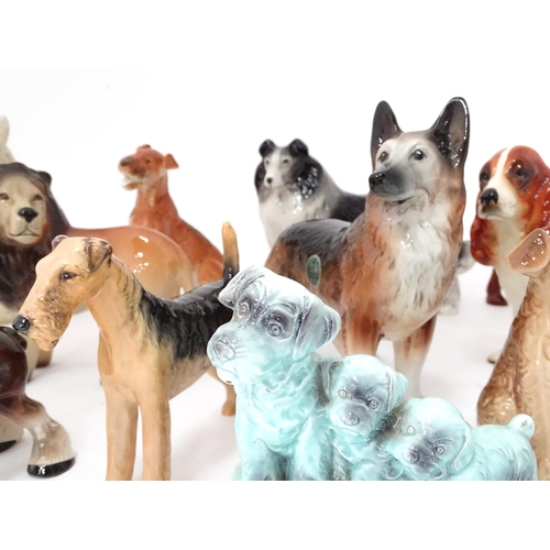 347 - A quantity of assorted ceramic models of dogs to include a Beswick Airedale Terrier - Champion Cast ... 