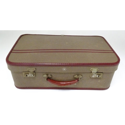 225 - Two mid 20thC suitcases, the largest example constructed from canvas with bamboo binding,  approx 24... 